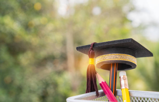 istock Graduate study or Education knowledge is power concept: Graduated cap Put on color pencil in basket. Conceptual for Educational is successs study or business world. Back to School ideas. 943733522