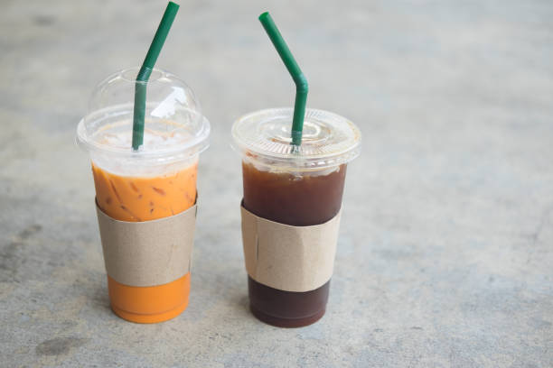 istock Close up iced Thai tea and iced black coffee in plastic cup 943735910