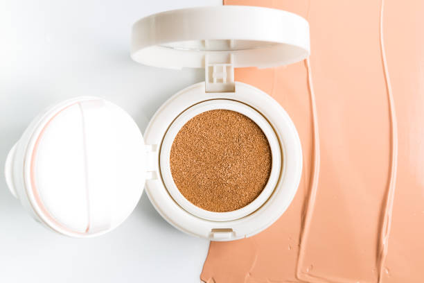istock Foundation cushion with sponge and puff on white background. 943735932