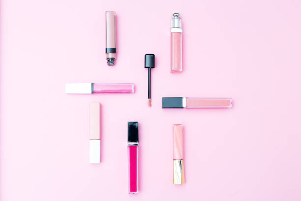 istock Cosmetics set for makeup on a pink background. Geometric style 943736278