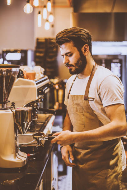 istock Young barista is making a coffee in cafe shop 943739552