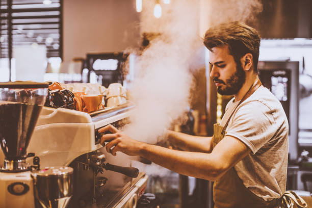 istock Young barista is making a coffee in cafe shop 943739768
