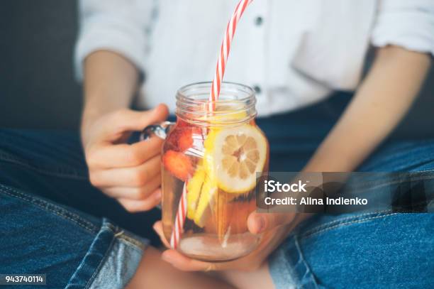 Cropped Shot Of Young Woman Drinking Home Made Fresh Summer Drink From Mason Jar With Straw Stock Photo - Download Image Now
