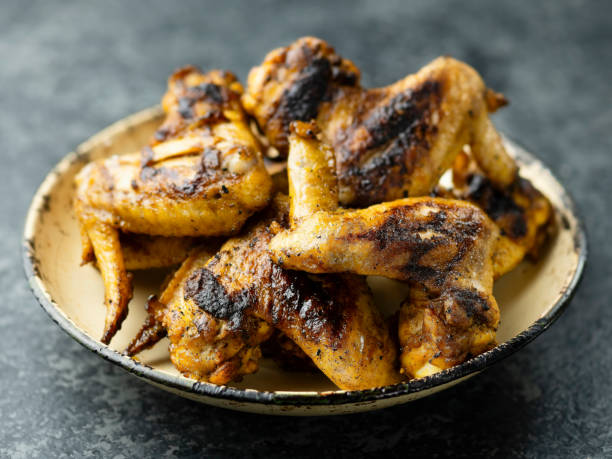 istock plate of barbecue chicken wing 943740392