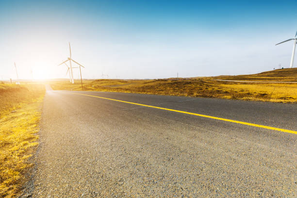 istock Wind turbines by road 943743818