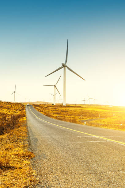 istock Wind turbines by road 943743856