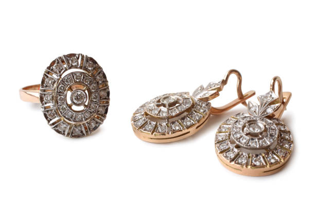 Golden earrings and ring with diamonds