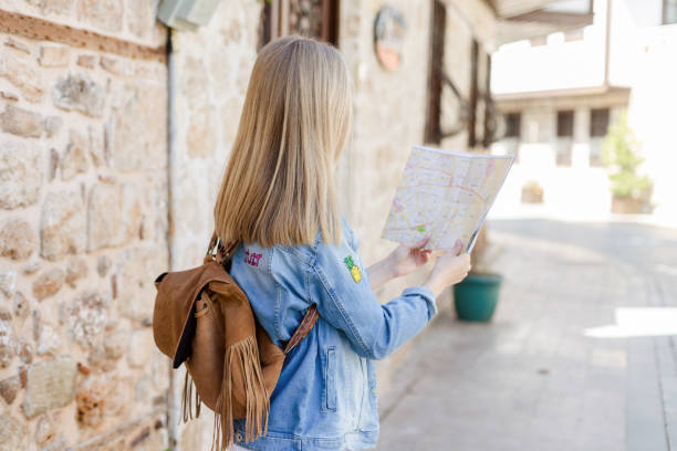 istock Tourist looking at the map in old city 943754102