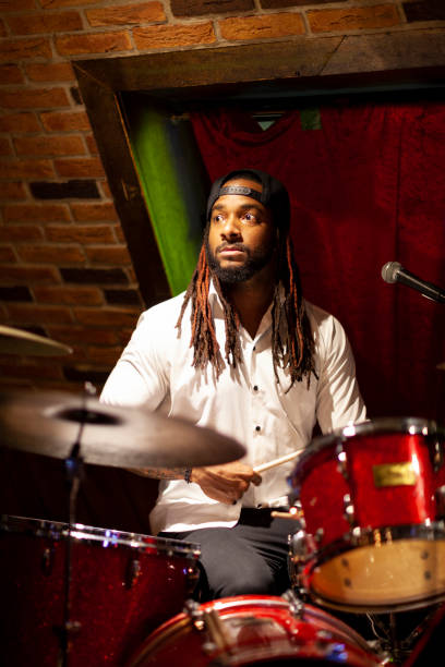 istock Drummer performing in live music event 943761514