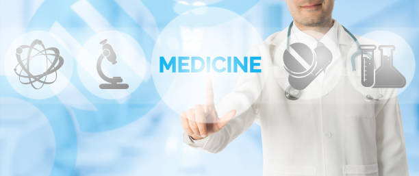 istock Doctor Points at MEDICINE with Medical Icons 943761796