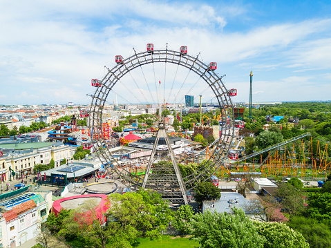 Illuminated Ferris Wheel at Night, A dark night sky and a brightly illuminated funfair wheel, Amusement Park Night View, Illuminated Ferris Wheel, Illuminated Ferris Wheel in Amsterdam at Night