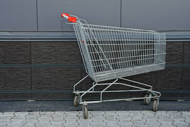 istock empty iron cart from the supermarket near the wall 943768196