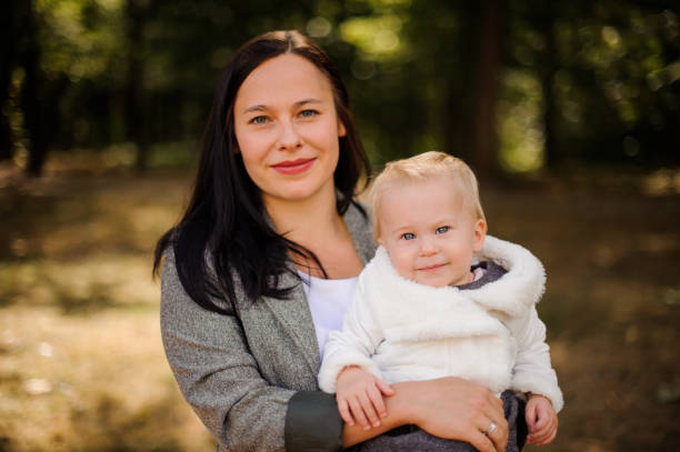 istock Brunette mother with a cute little daughter 943772642