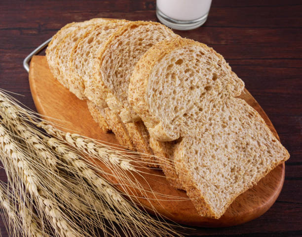 istock Whole wheat breads on wooden background 943772786