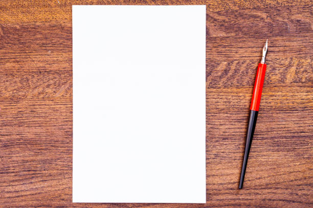 istock White sheet on the background of a wooden surface. 943776008