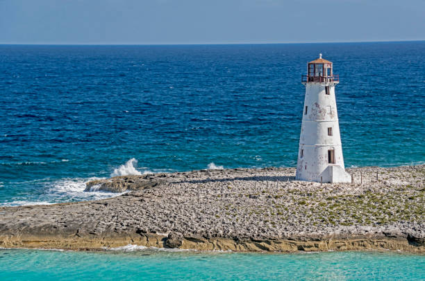 istock Old vintage lighthouse is surrounded with water in the Bahamas. 943779936
