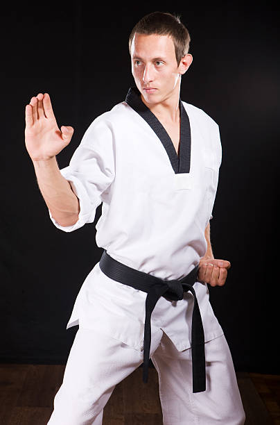istock young man ready to fight on black with path 94378136