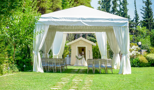 istock Outdoor reception under tents and trees 943782686