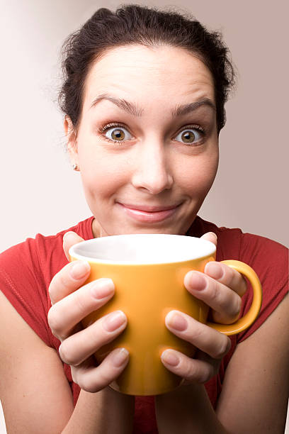 istock positive girl with yellow cup 94378326