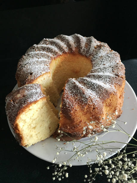 istock Whole Bundt Cake on plate and black background 943783346