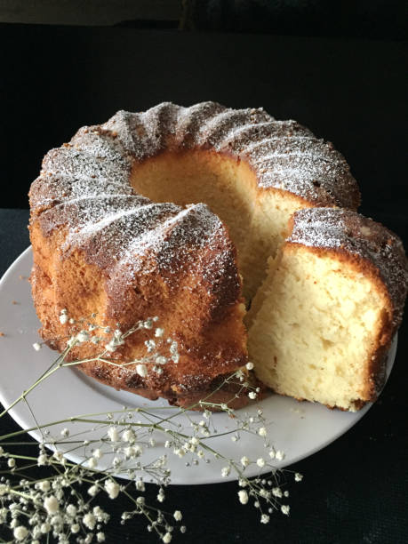 istock Whole Bundt Cake on plate and black background 943783384