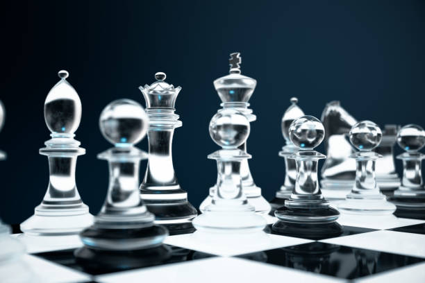 istock 3D illustration Chess game on board. Concepts business ideas and strategy ideas. Glass chess figures on a dark background with depth of field effects 943787054