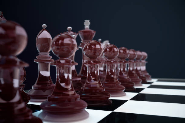 istock 3D illustration Chess game on board. Concepts business ideas and strategy ideas. Glass chess figures on a dark background with depth of field effects 943787070