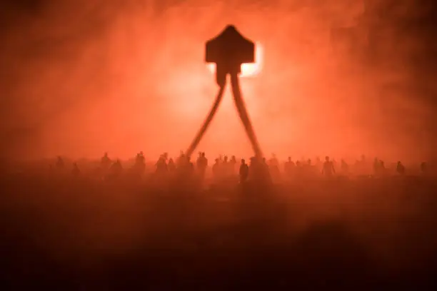 Blurred silhouette of giant monster prepare attack crowd during night. Selective focus.