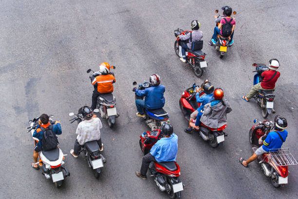 istock People are on motorbikes in huge Asian city 943807268