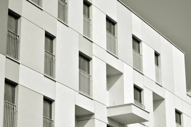 istock Facade of a modern apartment building. Black and white. 943808302