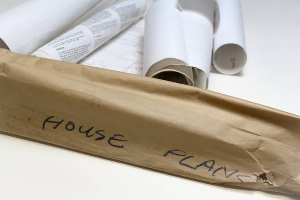 istock House Plans Written on outside wrapper of old blueprints 943810838