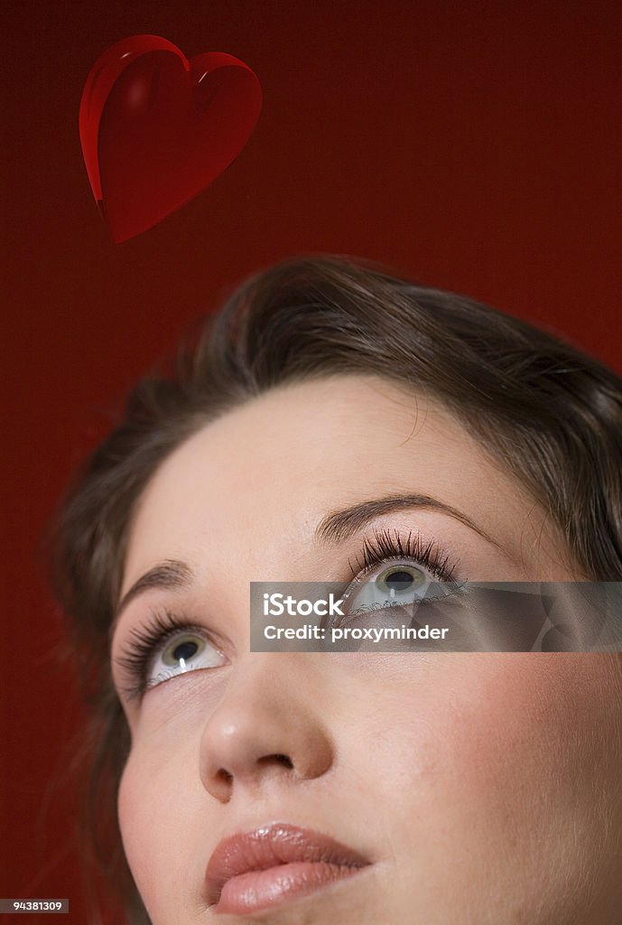 Dazed face A woman looking up... on heart shapes Adolescence Stock Photo