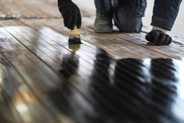 istock worker paints the metal 943815662