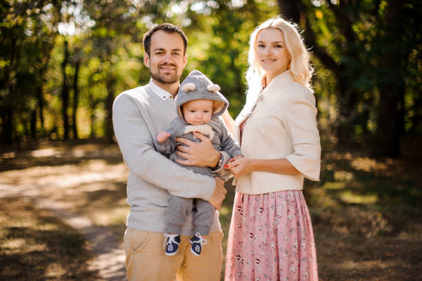 istock Happy young parents with a cute baby son 943818896