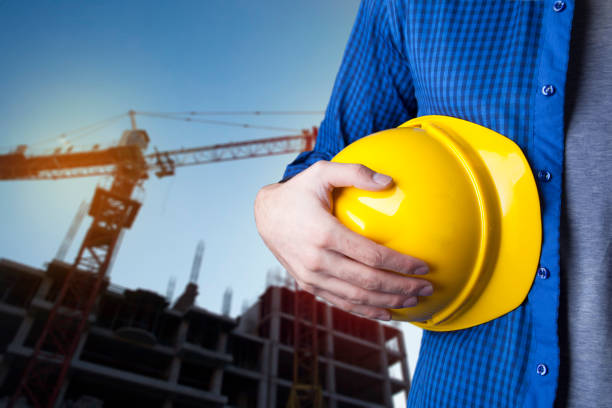 istock Engineer holding a yellow helmet for the safety of construction workers 943819032
