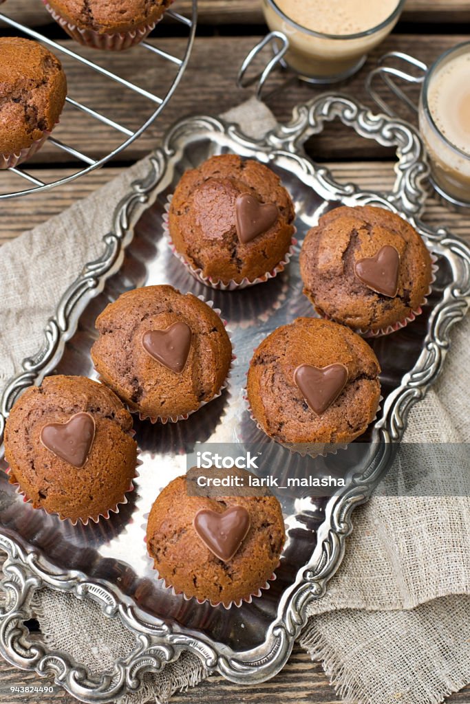 Chocolate muffins with chocolate chips and chocolate heart Sweet chocolate muffins with chocolate chips and chocolate heart Coffee - Drink Stock Photo