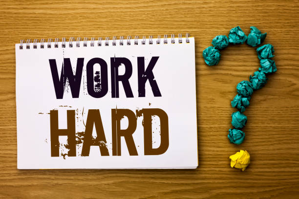 istock Text sign showing Work Hard. Conceptual photo Struggle Success Effort Ambition Motivation Achievement Action written on Notebook Book on the Wooden background Ask for. 943828150