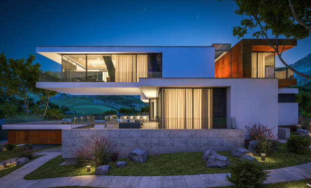 istock 3d rendering of modern cozy house by the river at night 943830380