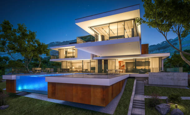 istock 3d rendering of modern cozy house by the river at night 943830392
