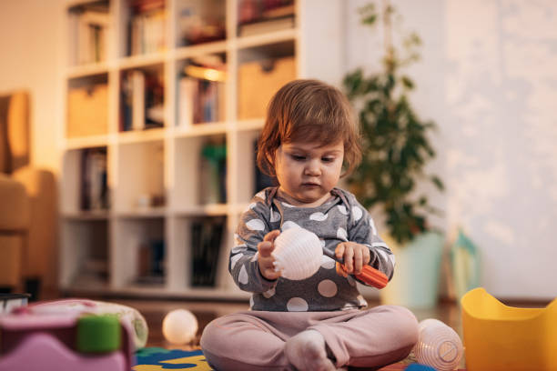 istock Baby girl develops her personality through playing 943830876