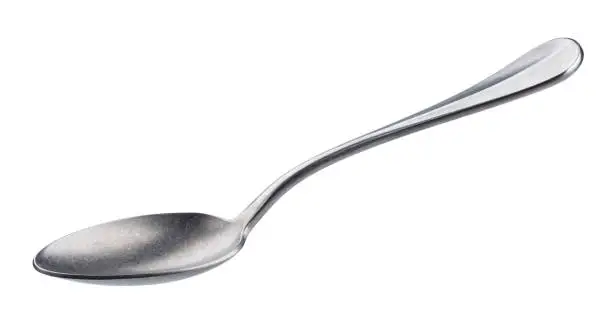 Empty metal spoon isolated on white background with clipping path