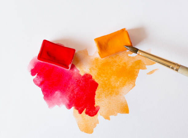 istock White paper brush red and orange watercolor 943831988