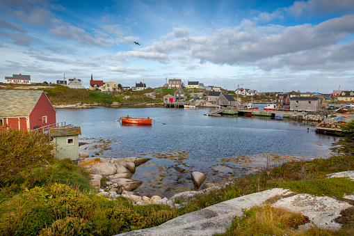 Clouds roll over the colorful town of Peggy's Cove near Halifax, Nova Scotia in Canada.