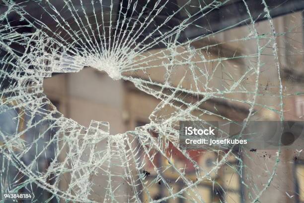 Hole In Broken Shattered Security Glass Insurance Security Crime Concept Stock Photo - Download Image Now