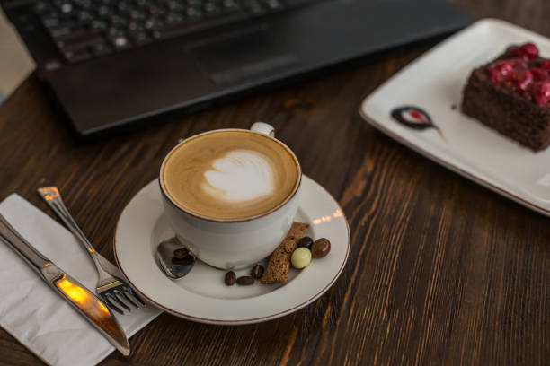 istock A cup of cappucino on wooden tabletop 943848236