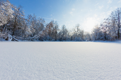 Snow texture and deautiful winter landscape with snow covered lake