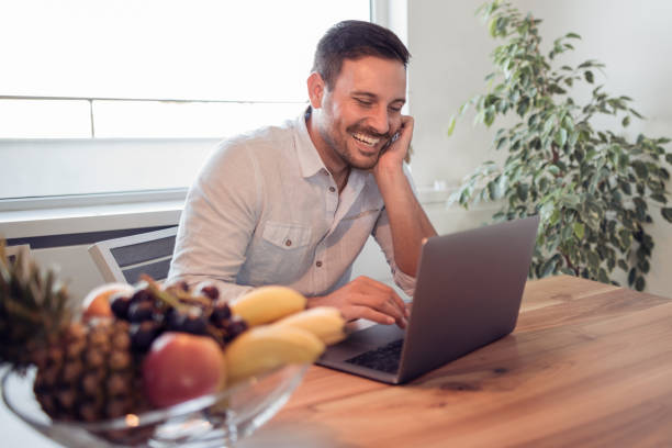 istock Businessman at home,he is working with a laptop 943851994