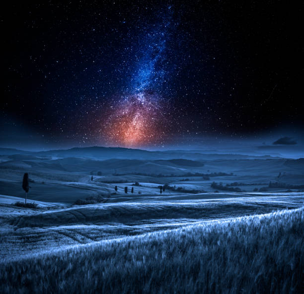 istock Milky way and field in Italy at night 943852344