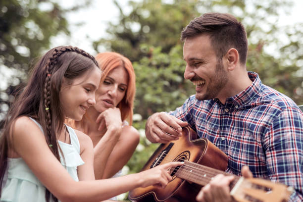 istock Happy family having fun in the park 943859626