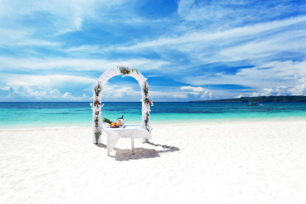istock Beautiful wedding arch on tropical beach 943866554